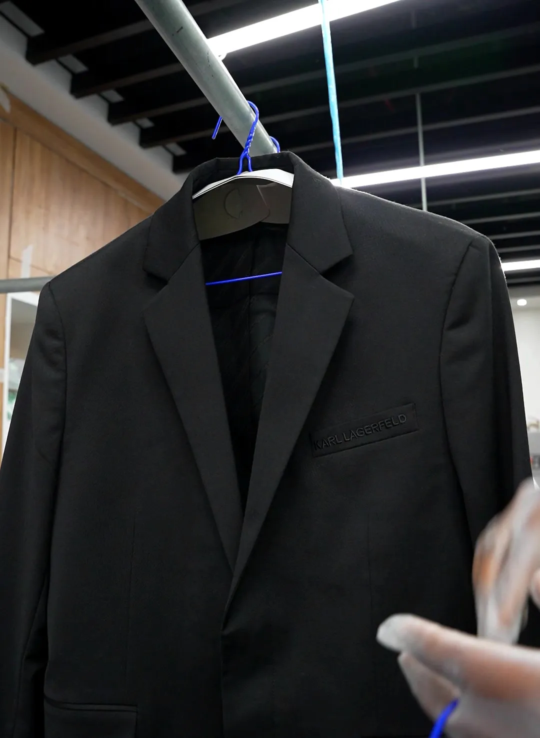Cleaned jacket on a hanger at Grand Laundry, Abu Dhabi